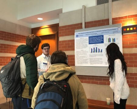 Students looking at poster
